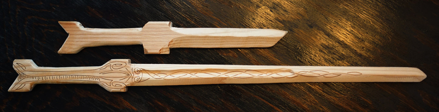 Two examples of wood swords. On the top is a no-frills "Dagger" size, and on the bottom is a "Sword" size with Celtic laser engraving and a round groove.